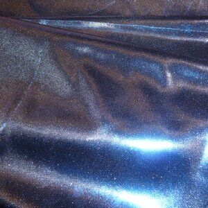 Highly shiny royal blue fabric with matte black reverse side